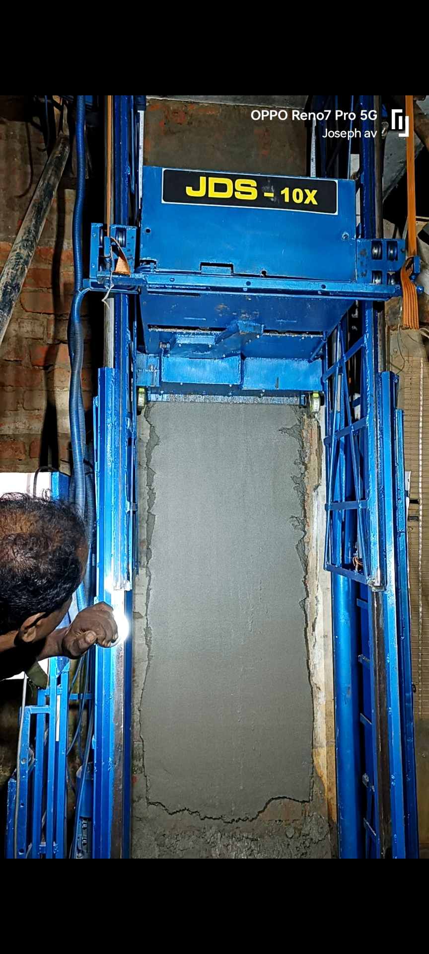 JDS-10X plastering a wall in action